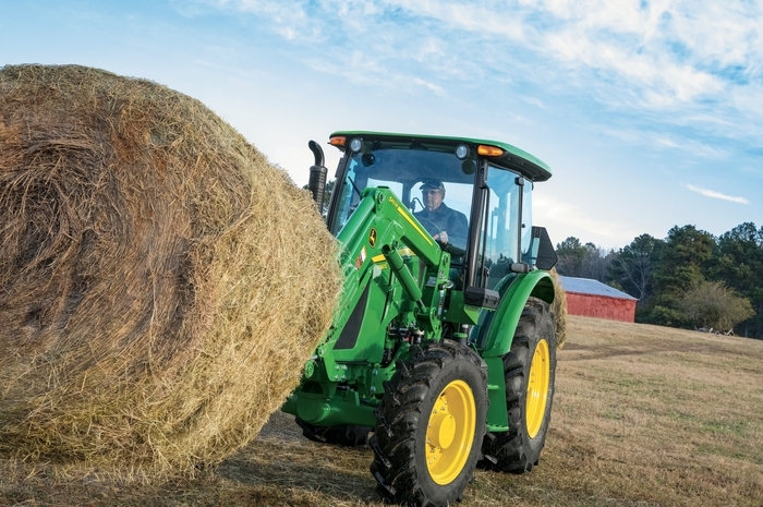 John Deere 5090e Utility Tractor with bale of hay